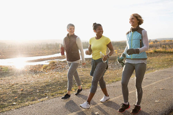 Three women walking together and laughing