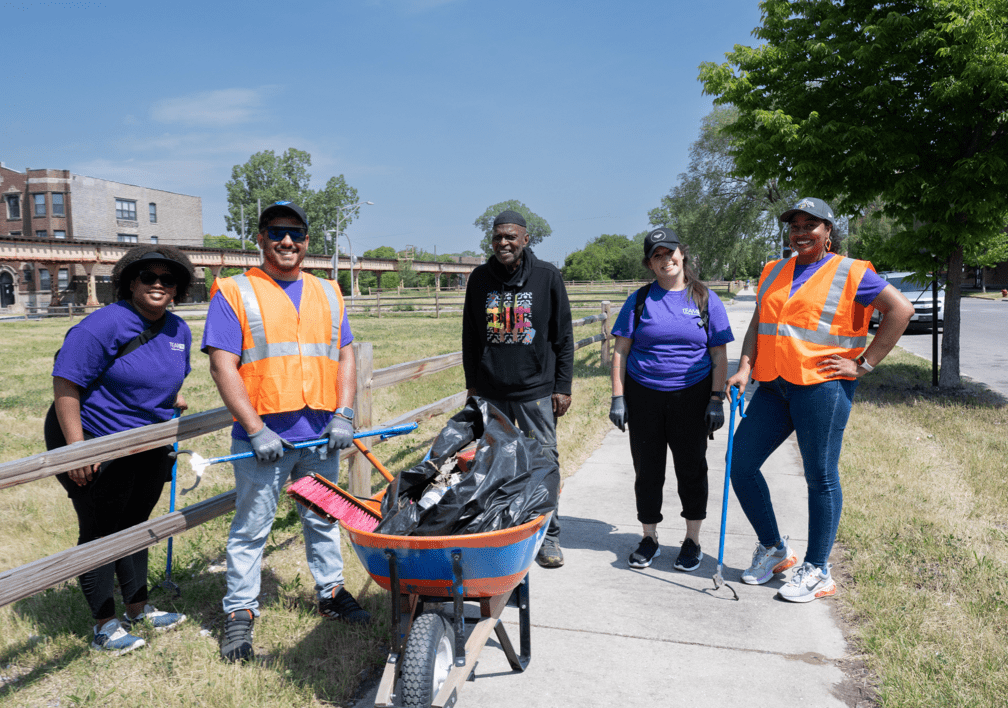 TEAM NM volunteers cleaning up a public space.