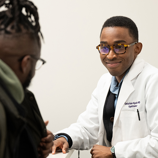 Ophthalmologist meeting with a patient during an eye care consultation at a Northwestern Medicine clinic.