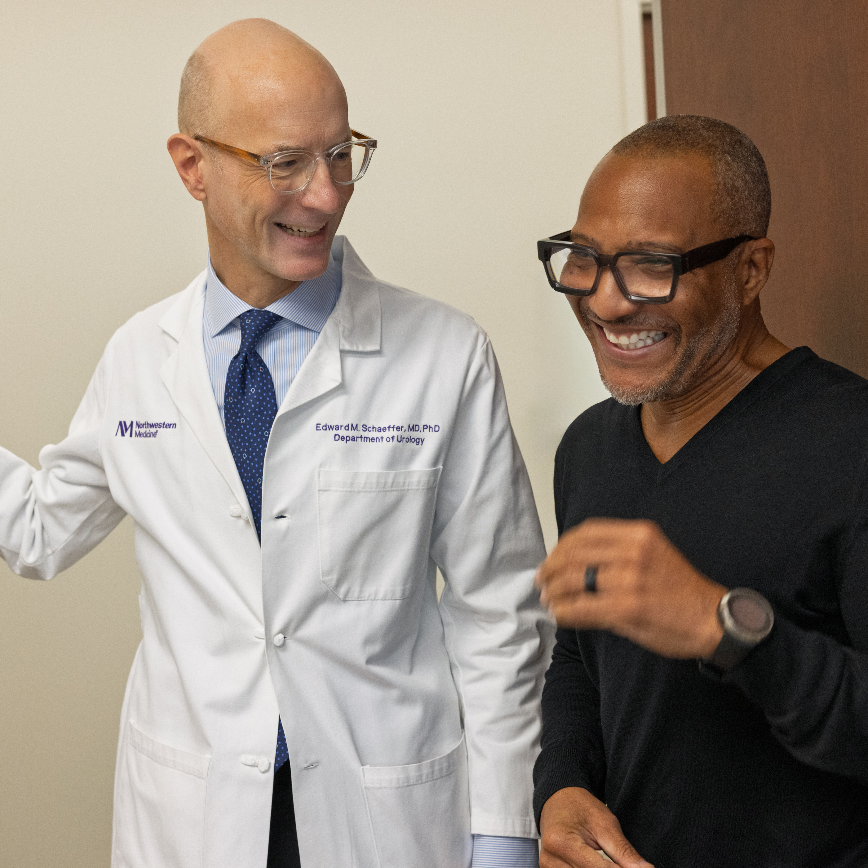 Dr. Schaeffer and patient smiling in a clinical setting