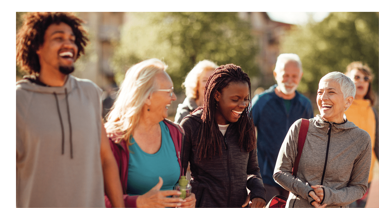 Smiling group of people walking together outdoors