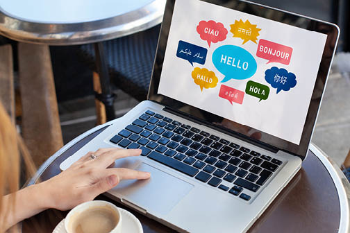 Learn foreign language, different languages on screen, english, french, german, arabic, chinese, say Hello Bonjour Ciao Hola