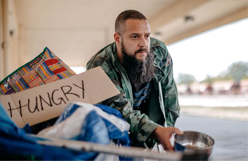 Homeless man asking for help in public