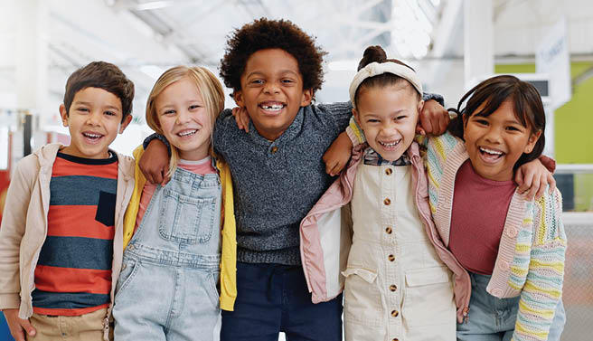 Science, portrait and group of children with happiness at convention, expo or exhibition for workshop. Student, kid or face with smile at tradeshow or scientific conference for knowledge or education