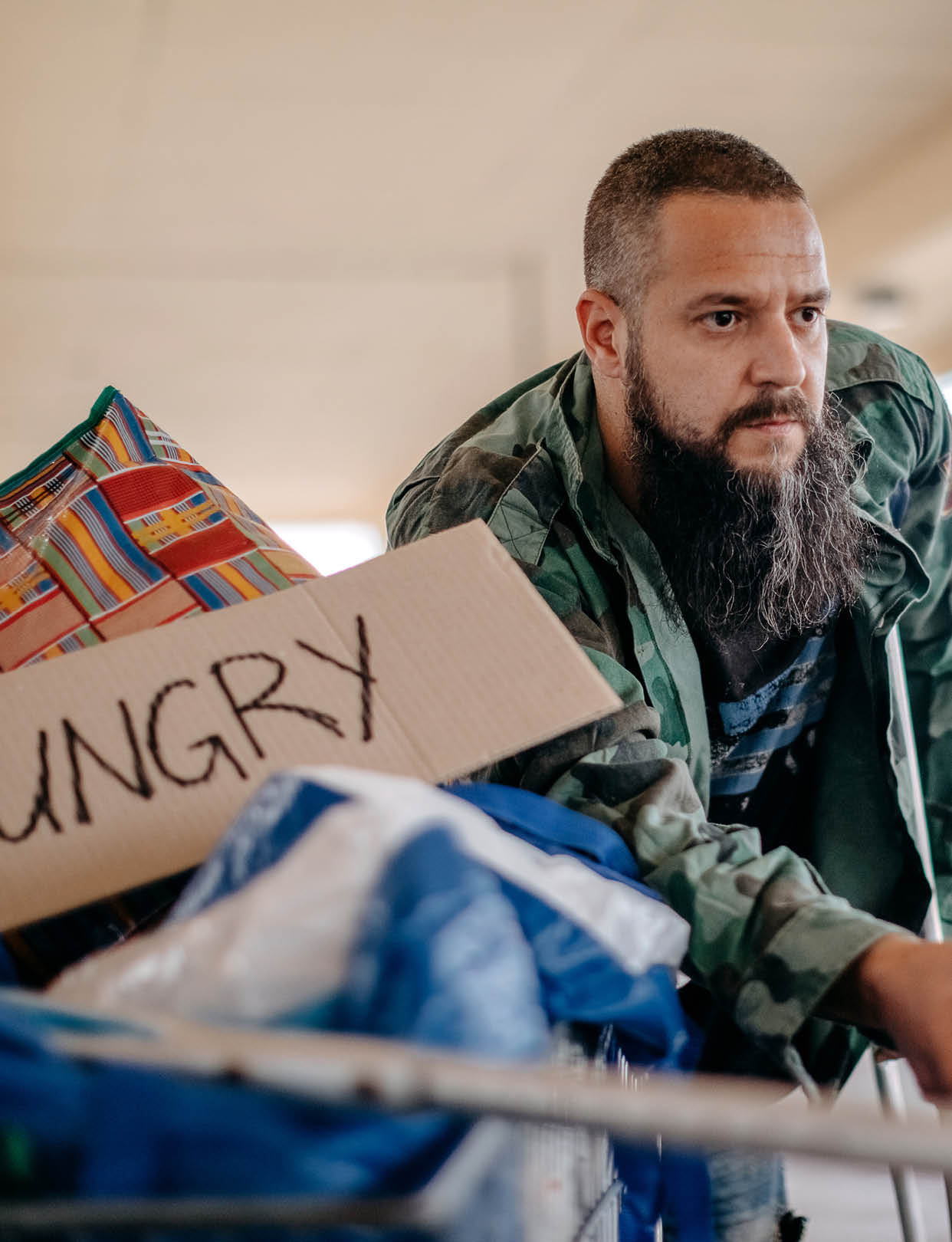 Homeless man asking for help in public