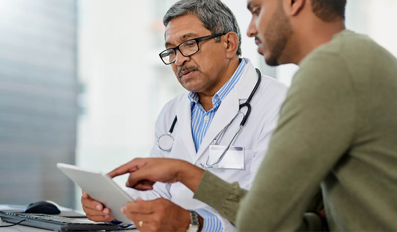 Shot of a doctor having a consultation with a patient in his office