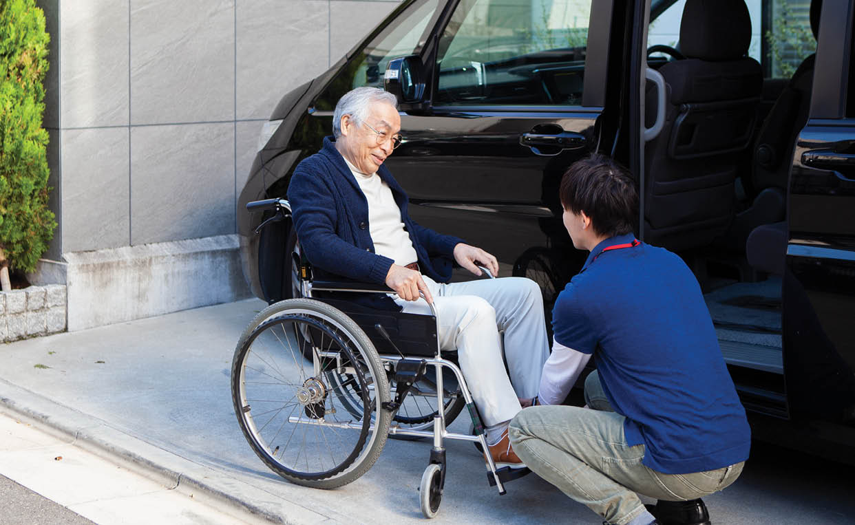 An elderly man and public services for active living despite physical disability.