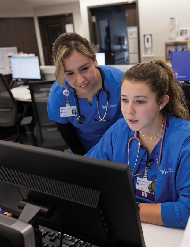Two women working in a hospital. Description generated by AI