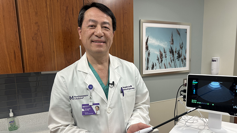 Alexander L. Lin, MD with an ultrasound.