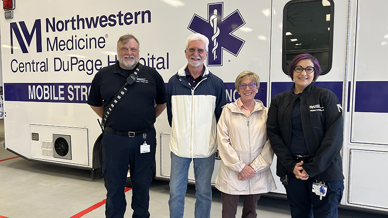 Northwestern Medicine patient, Karen Blinstrup, stands with her husband and two of the Mobile Stroke Unit team members who treated her.
