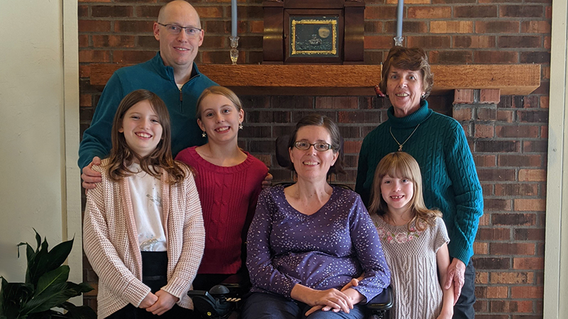 Kristin Rankin surrounded by her husband, three daughters and mother. 